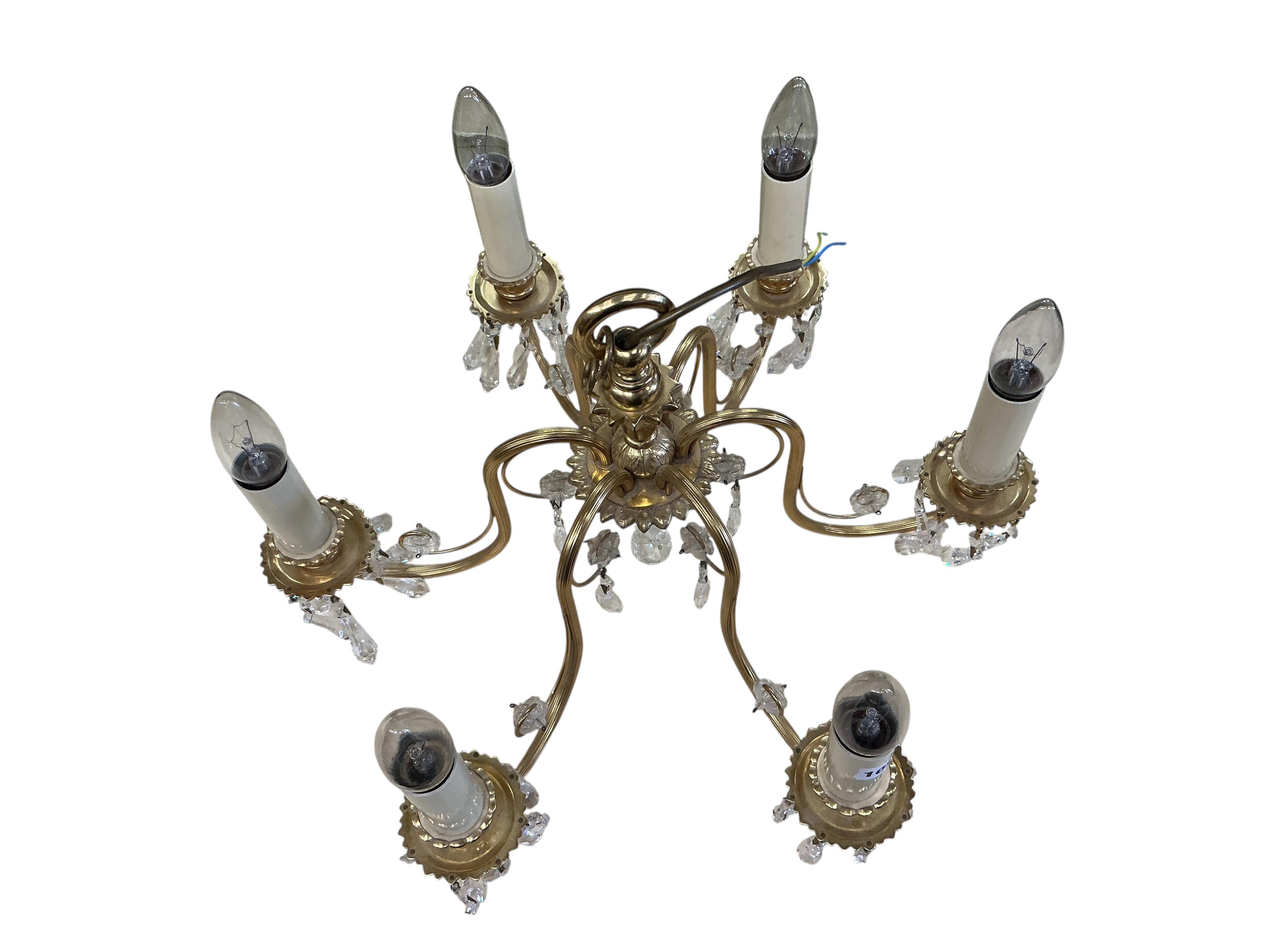 A brass six branch electrolier hung faceted glass drops, height 30cm.